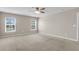 Large bedroom featuring bright windows and ceiling fan at 5138 Preserve Blvd, Ladson, SC 29456