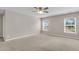 Large bedroom with carpet, ceiling fan, and two windows at 5138 Preserve Blvd, Ladson, SC 29456