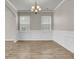 Dining room with wainscoting and a chandelier, perfect for elegant meals at 5138 Preserve Blvd, Ladson, SC 29456