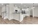 Modern kitchen with stainless appliances, granite countertops, and an island breakfast bar at 5138 Preserve Blvd, Ladson, SC 29456