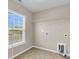 Bright laundry room with tile floors and window at 5138 Preserve Blvd, Ladson, SC 29456