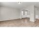 Expansive living area featuring hardwood flooring and seamless transition to dining, perfect for modern living at 5138 Preserve Blvd, Ladson, SC 29456