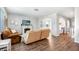 Spacious living room with hardwood floors and an archway leading to the hallway at 5138 Preserve Blvd, Ladson, SC 29456