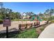 Community playground featuring a slide, swings, benches, and picnic tables, perfect for Gathering fun at 5138 Preserve Blvd, Ladson, SC 29456