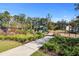 Community playground featuring a slide, swings, benches, and picnic tables, perfect for Gathering fun at 5138 Preserve Blvd, Ladson, SC 29456