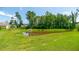 Community pond with lush landscaping, offering a serene outdoor space for residents at 5138 Preserve Blvd, Ladson, SC 29456