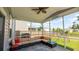 Screened porch with ample seating overlooks the backyard play area at 5138 Preserve Blvd, Ladson, SC 29456