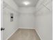 An empty walk-in closet with white walls and metal shelving on all sides at 5138 Preserve Blvd, Ladson, SC 29456