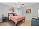 Comfortable bedroom with a ceiling fan, wood floors, and charming decor at 5433 Falling Tide, North Charleston, SC 29420