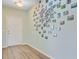 Bright entryway with hardwood floors and modern decor leading to a spacious living area at 5433 Falling Tide, North Charleston, SC 29420