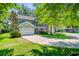 Charming two-story home featuring a manicured lawn, attached garage, and welcoming front porch at 5433 Falling Tide, North Charleston, SC 29420