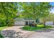 Charming two-story home featuring a manicured lawn, attached garage, and welcoming front porch at 5433 Falling Tide, North Charleston, SC 29420