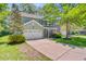 Charming two-story home featuring a manicured lawn, attached garage, and welcoming front porch at 5433 Falling Tide, North Charleston, SC 29420