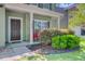 Inviting front porch with neatly trimmed shrubbery and a quaint seating area for relaxing at 5433 Falling Tide, North Charleston, SC 29420