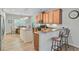 Well-appointed kitchen with stainless steel appliances, granite countertops, and a breakfast bar at 5433 Falling Tide, North Charleston, SC 29420