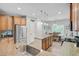 Spacious kitchen featuring stainless steel appliances, a center island, and an adjacent dining area at 5433 Falling Tide, North Charleston, SC 29420