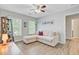 Bright living room with a comfy sectional sofa, light-filled windows and plants at 5433 Falling Tide, North Charleston, SC 29420