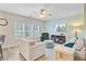 Inviting living room with a plush sofa, recliner, ceiling fan, and a mounted TV at 5433 Falling Tide, North Charleston, SC 29420
