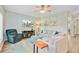 Comfortable living room with a plush sofa, recliner, ceiling fan, and entertainment center at 5433 Falling Tide, North Charleston, SC 29420