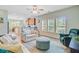 Cozy living room flowing into the kitchen, featuring comfortable seating and natural light at 5433 Falling Tide, North Charleston, SC 29420