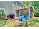 Exterior view of screened porch with patio furniture, grill and fire pit area at 5433 Falling Tide, North Charleston, SC 29420