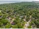 An aerial view displays this property among a neighborhood of tree-lined streets at 614 Beauregard St, Charleston, SC 29412
