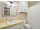 Bathroom featuring a white vanity, silver framed mirror, and a shower at 614 Beauregard St, Charleston, SC 29412