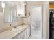 Bright bathroom with tiled floors, modern vanity, and a linen closet at 614 Beauregard St, Charleston, SC 29412