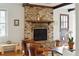 Spacious living room features a brick fireplace, hardwood floors, and lots of natural light at 614 Beauregard St, Charleston, SC 29412