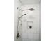 Modern bathroom with rainfall shower and shampoo niche at 614 Beauregard St, Charleston, SC 29412