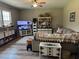 Comfortable living room with a ceiling fan, neutral walls, and a comfortable sofa with decorative pillows at 677 Redbud Ln, Summerville, SC 29486
