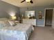 Comfortable primary bedroom featuring a queen bed, neutral carpet and paint, and a large dresser with a mirror at 677 Redbud Ln, Summerville, SC 29486