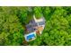 Aerial view of the backyard featuring pool, patio, and mature landscaping at 69 King Charles Cir, Summerville, SC 29485