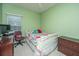 Cozy bedroom features a comfortable bed with colorful bedding and a window bringing in natural light at 69 King Charles Cir, Summerville, SC 29485
