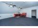 Versatile bonus room with ample space, featuring multiple ceiling fans and tool storage at 69 King Charles Cir, Summerville, SC 29485