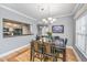 Dining area featuring hardwood floors and modern chandelier lighting at 69 King Charles Cir, Summerville, SC 29485