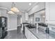 Kitchen featuring a black refrigerator, gray countertops, white cabinets and stainless steel dishwasher at 69 King Charles Cir, Summerville, SC 29485