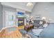 Inviting living room features a fireplace, ceiling fan and beautiful hardwood floors and neutral walls at 69 King Charles Cir, Summerville, SC 29485