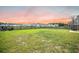 Expansive backyard with lush green grass and a fence, offering plenty of space for recreation and outdoor activities at 705 Squire Pope Rd, Summerville, SC 29486