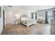 Bright, spacious bedroom featuring hardwood floors and a writing desk, creating a functional and stylish living space at 705 Squire Pope Rd, Summerville, SC 29486