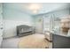 Inviting Bedroom features a modern crib, cozy armchair, and soothing color palette, perfect for a peaceful retreat at 705 Squire Pope Rd, Summerville, SC 29486
