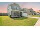 Charming two-story home with a stone facade, front porch, and well-manicured lawn at 705 Squire Pope Rd, Summerville, SC 29486
