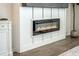 A modern fireplace with white paneling and a wooden mantle at 705 Squire Pope Rd, Summerville, SC 29486