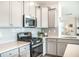 Bright kitchen featuring stainless steel appliances, white cabinetry, and quartz countertops at 705 Squire Pope Rd, Summerville, SC 29486