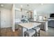 Open-concept kitchen with island seating and stainless appliances at 705 Squire Pope Rd, Summerville, SC 29486