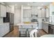 Bright kitchen with stainless steel appliances and gray cabinetry at 705 Squire Pope Rd, Summerville, SC 29486