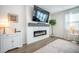 Bright living room features a fireplace, tv, and neutral decor at 705 Squire Pope Rd, Summerville, SC 29486
