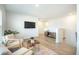 Cozy upstairs living room with chairs, a TV, and hardwood floors at 705 Squire Pope Rd, Summerville, SC 29486