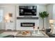 Bright living room features a fireplace, tv, and neutral decor at 705 Squire Pope Rd, Summerville, SC 29486
