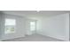 Unfurnished bedroom featuring neutral carpeting and two windows for natural light at 737 Meadowbrook Ln, Summerville, SC 29486